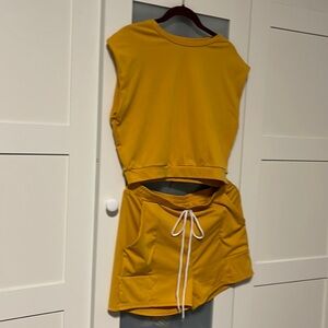 Set of golden yellow colored short set for work out or jogging